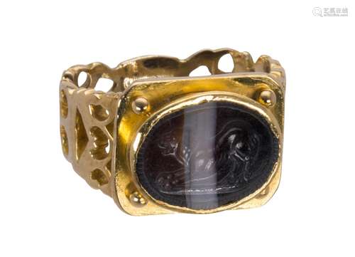 Agate intaglio and 14k yellow gold ring Featuring (1) oval black and white banded agate intaglio,