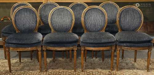 (lot of 8) Louis XVI style side chairs, each having a balloon back, with blue upholstery, and rising