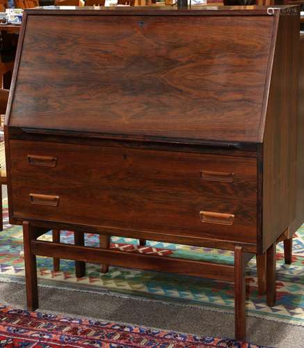 Danish Modern rosewood slant front desk, having a hinged front opening to a fitted interior, above