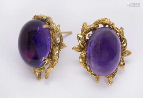 Pair of amethyst and 14k yellow gold earrings Featuring (2) oval amethyst cabochons, measuring