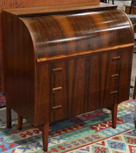 Danish Modern rosewood cylinder desk, having a roll top opening to a fitted interior, above the