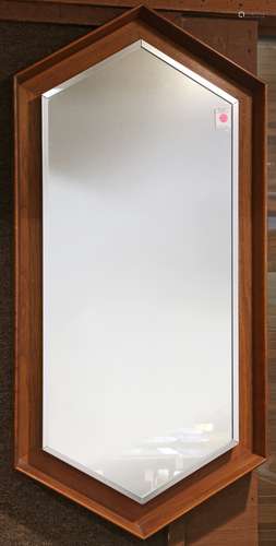 Mid Century framed wall mirror by Arthur Umanoff for Howard Miller, having a walnut hexagonal