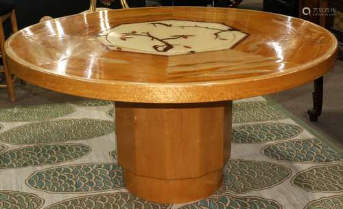 Moderne inlaid maple dining table, having a circular top, centered with a Lazy Susan, accented