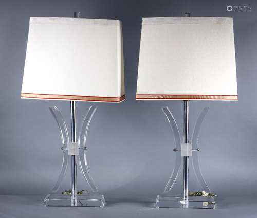 Pair of Moderne acrylic table lamps, each having a single light, above a geometric form standard and