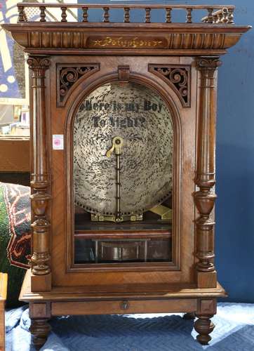 (lot of 12) Polyphon upright disc music box, the coin operated music box having a gilt walnut carved