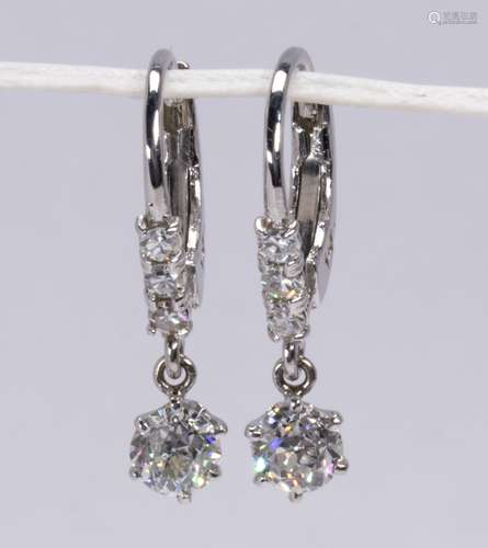 Pair of diamond and 14k white gold earrings Featuring (2) old European-cut diamonds, weighing a