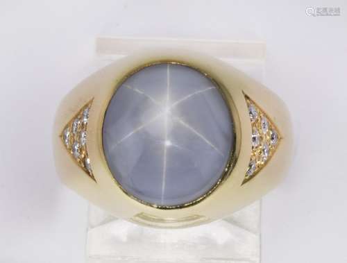 Star sapphire, diamond and 18k yellow gold ring Featuring (1) oval blue star sapphire, measuring