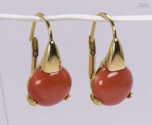 Pair of coral and 18k yellow gold earrings Featuring (2) round coral cabochons, measuring