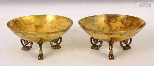 Pair of Tiffany and Co. sterling silver gilt footed bowls, the circular bowls rising on (3)