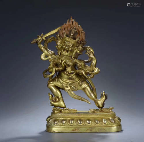 A GILT-BRONZE FIGURE