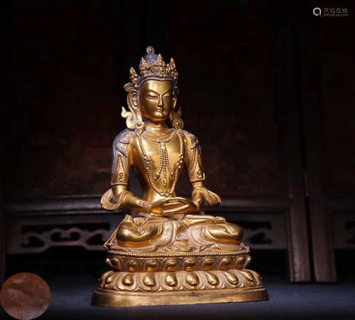 A GILT BRONZE MOLDED BUDDHA STATUE