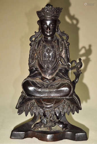 A BRONZE MOLDED BUDDHA STATUE