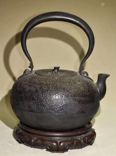 A IRON MOLDED WATER POT