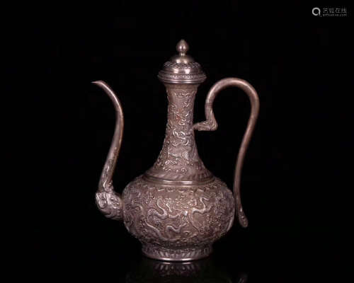 A OLD SILVER MOLDED WINE POT