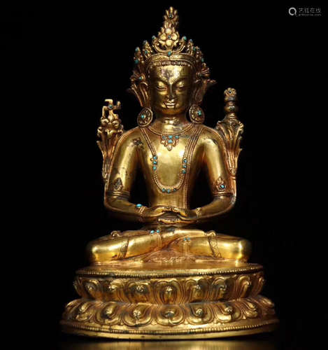 A GILT BRONZE MOLDED BUDDHA STATUE