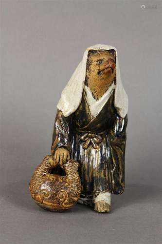 Japanese art pottery badger dressed as a nun