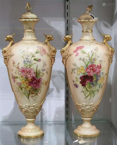 Pair of Royal Worcester parcel gilt porcelain urns