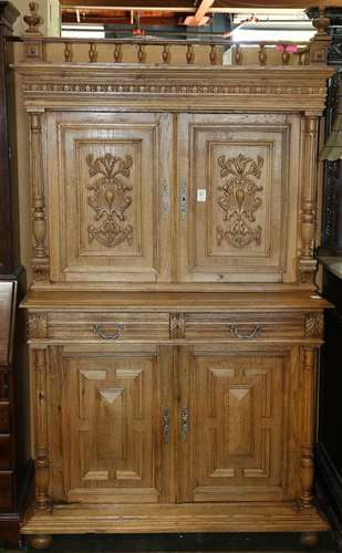 Renaissance style buffet deux corps, early 20th Century, the carved case with turned gallery crest, above the armorial carved four d...