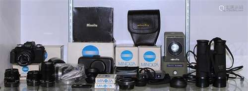 One shelf of Minolta cameras and equipment