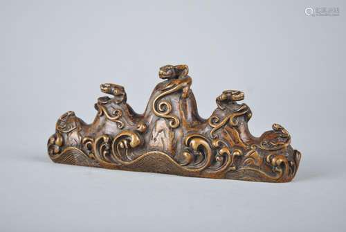 A BRONZE DRAGON' BRUSH REST, QIANLONG MARK, QING DYNASTY