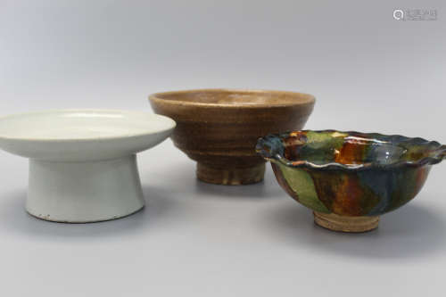 Three Asian pottery bowls.