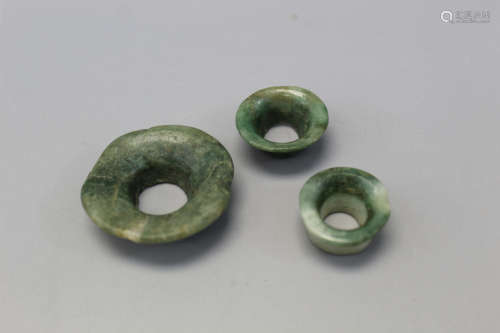Pre-Columbian Mayan jade ear spools.