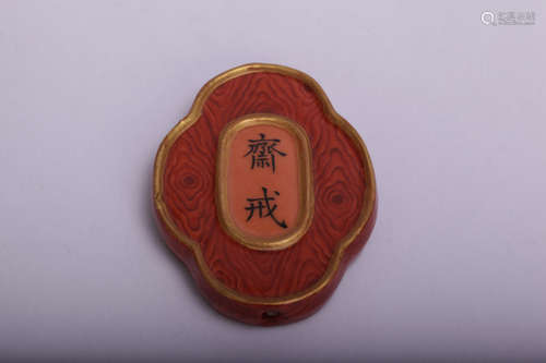 Chinese porcelain amulet.