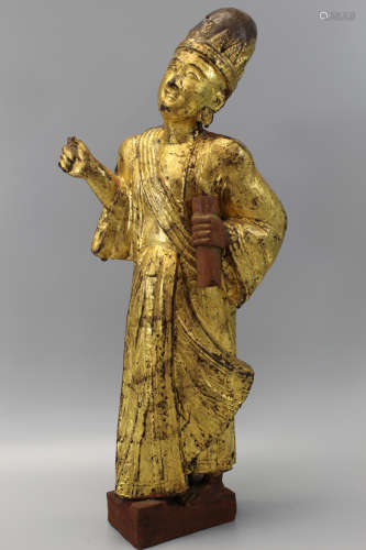 A southeast Asian gilted wood statue.
