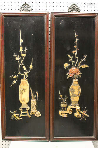 A pair of Chinese carved soapstone on wood panel.