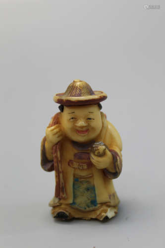 Japanese carved figurine of a boy.