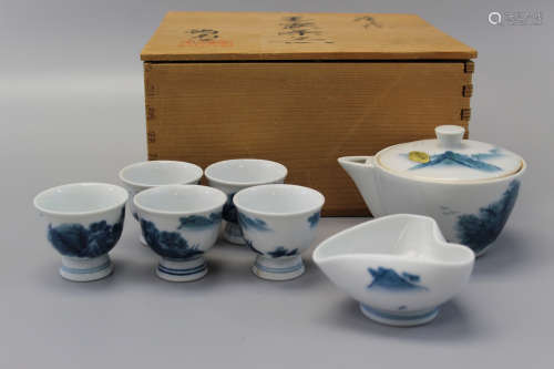 Set of Japanese teapot and cups in wood box.