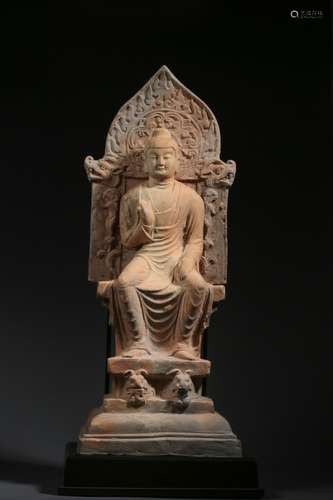 A pottery seated Buddha