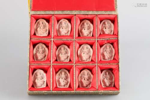 A set of red Pottery Buddhists (12 pics??