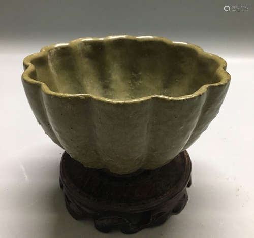 A CELADON-GLAZED MELON SHAPED BOWL