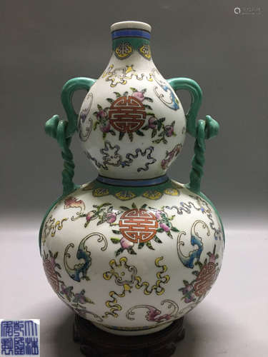 A FAMILLE ROSE GOURD-SHAPED VASE