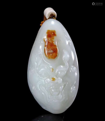 A HETIAN JADE MONSTER PATTERN PENDANT