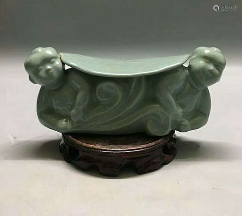 A CELADON GLAZED PILLOW