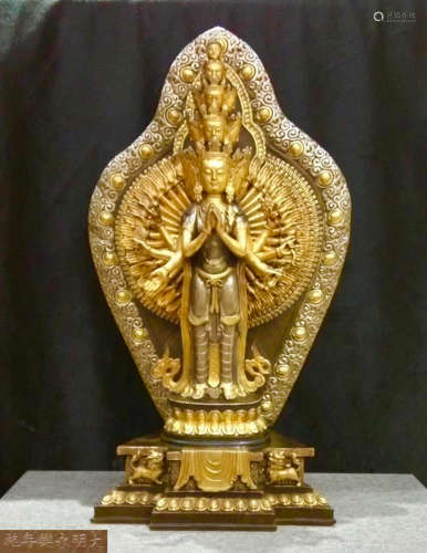 A BRONZE MOLDED GILT ARMS GUANYIN STATUE