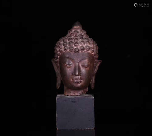 A IRON MOLDED BUDDHA HEAD STATUE