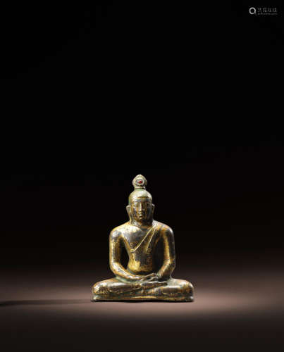 SRI LANKA, LATE ANURADHAPURA PERIOD, 8TH/9TH CENTURY A GILT COPPER ALLOY FIGURE OF BUDDHA