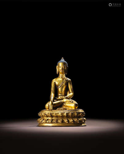 TIBET, 15TH CENTURY A GILT COPPER ALLOY FIGURE OF BUDDHA VAJRASANA