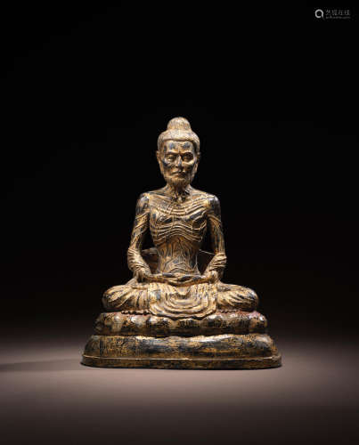 THAILAND, RATTANAKOSIN PERIOD, 19TH CENTURY A GILT LACQUERED COPPER ALLOY FIGURE OF EMACIATED BUDDHA