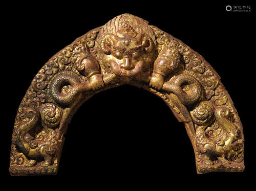 NEPAL, 17TH CENTURY A GILT COPPER ALLOY REPOUSSÉ TORANA