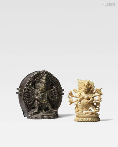 TIBET, 17TH/18TH CENTURY A PARCEL-GILT SILVER GAU WITH MAHOTTARA HERUKACONTAINING AN IVORY FIGURE OF SHADBHUJA MAHAKALA