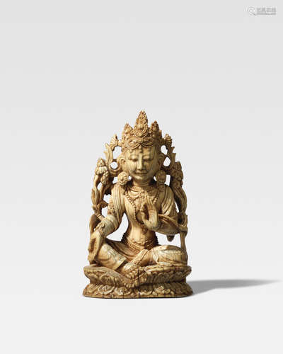 MING DYNASTY, 15TH CENTURY AN IVORY FIGURE OF SYAMATARA