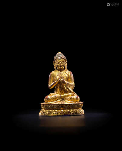 MING DYNASTY, 15TH CENTURY A GILT COPPER ALLOY FIGURE OF SHAKYAMUNI BUDDHA