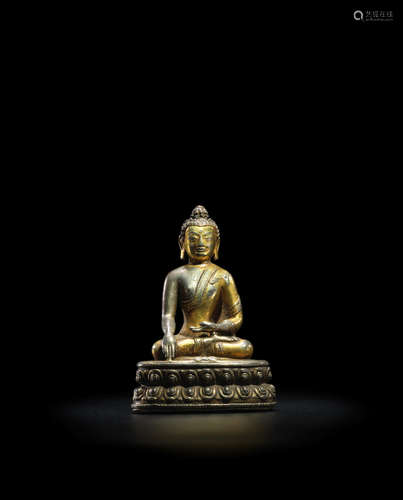 KHASA MALLA, CIRCA 14TH CENTURY  A PARCEL GILT SILVER FIGURE OF BUDDHA