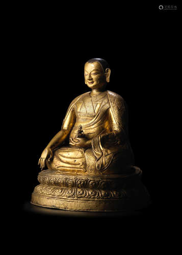 TIBET, 17TH CENTURY A LARGE GILT COPPER ALLOY REPOUSSÉ FIGURE OF A SAKYA LAMA