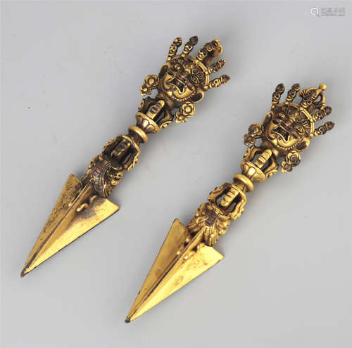 A PAIR OF GILT BRONZE DORJE PHURBA