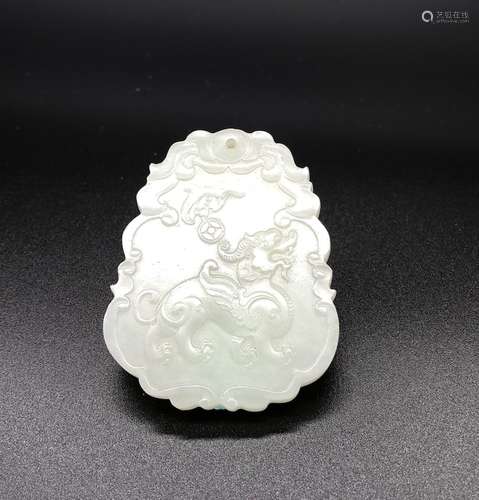 AN ARCHAIC JADE PLAQUE